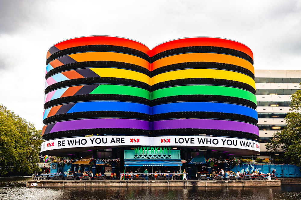 a large building with a giant rainbow colored book on top of it