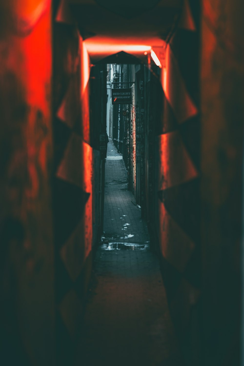 a long narrow hallway with a clock on the wall