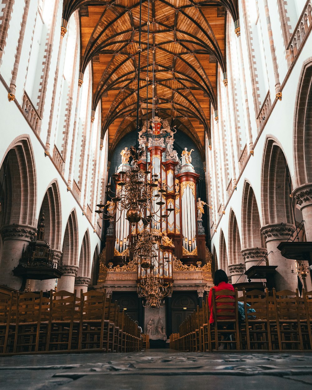 a large cathedral with a chandelier hanging from the ceiling