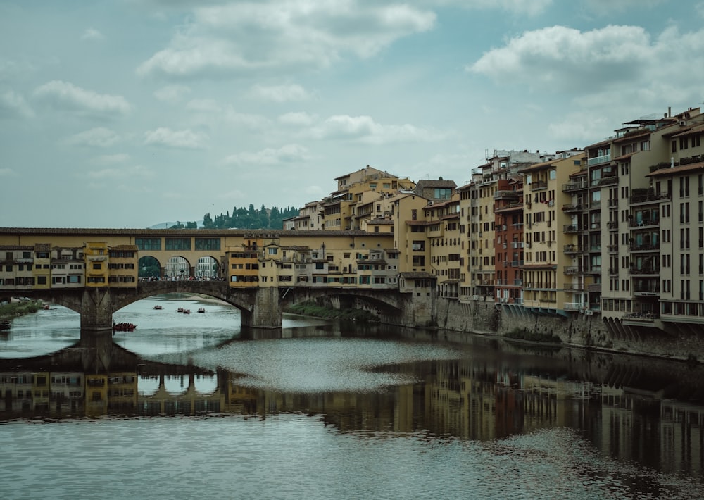 a bridge over a body of water next to buildings