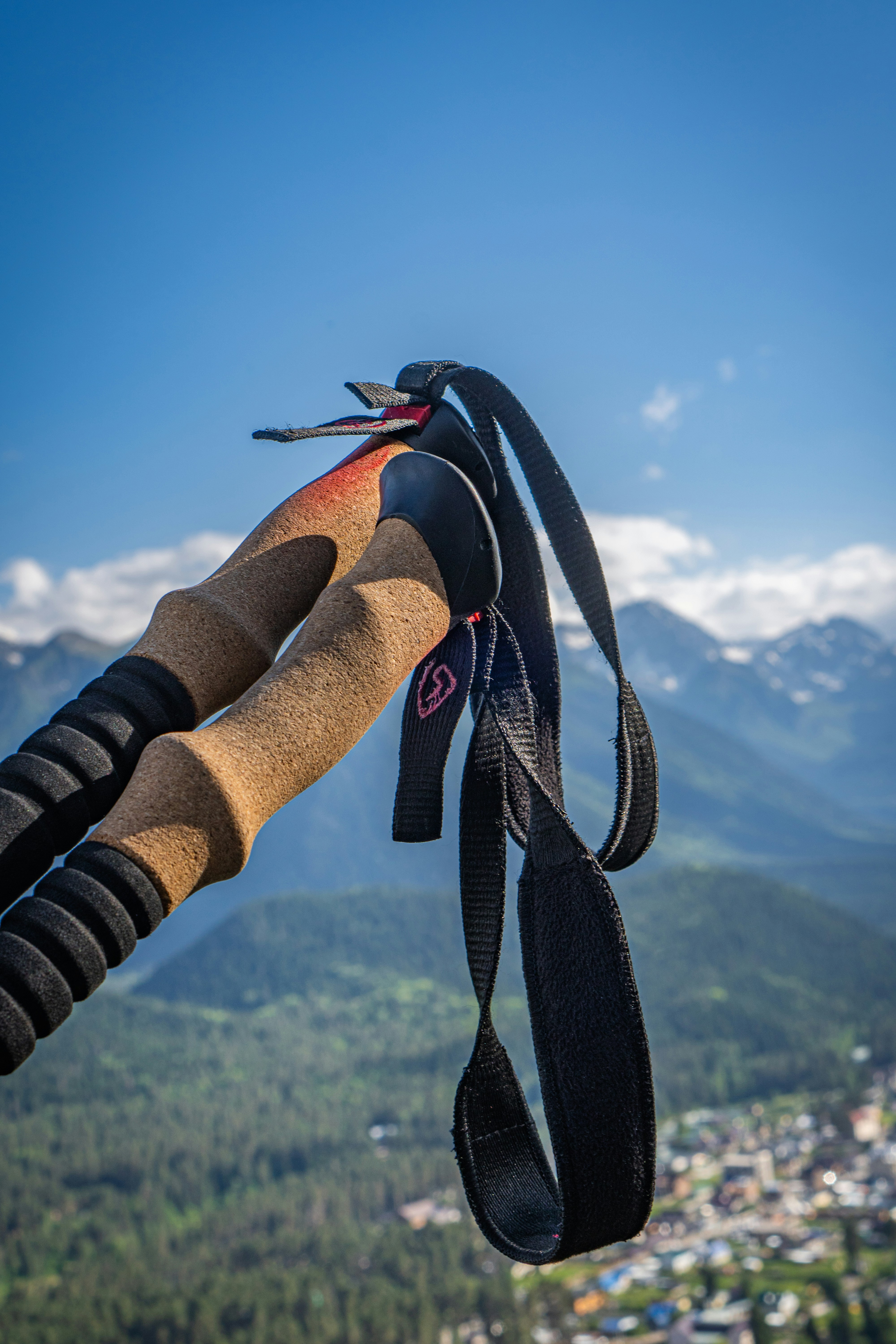 a pair of skis hanging from a rope in the air