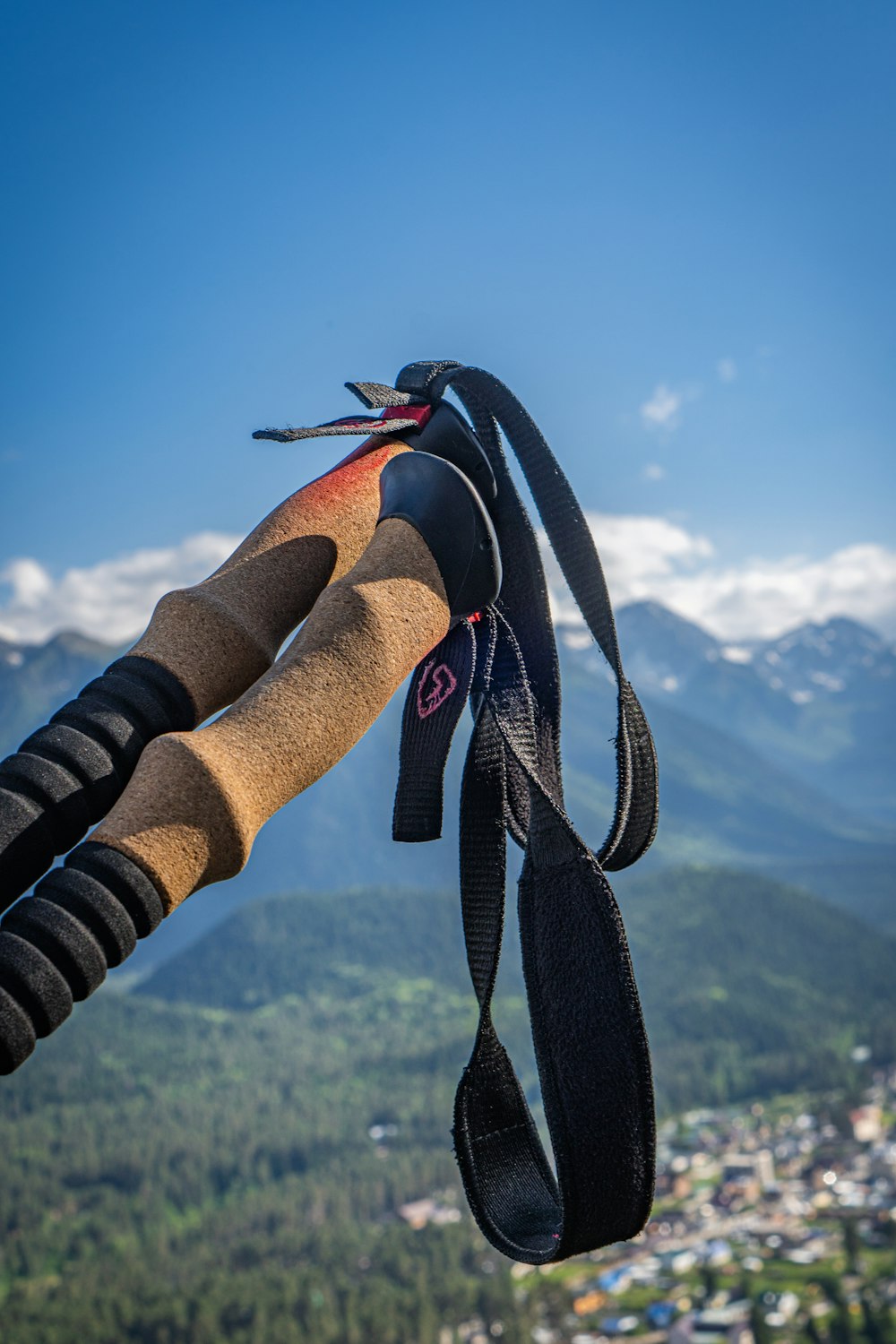 a pair of skis hanging from a rope in the air