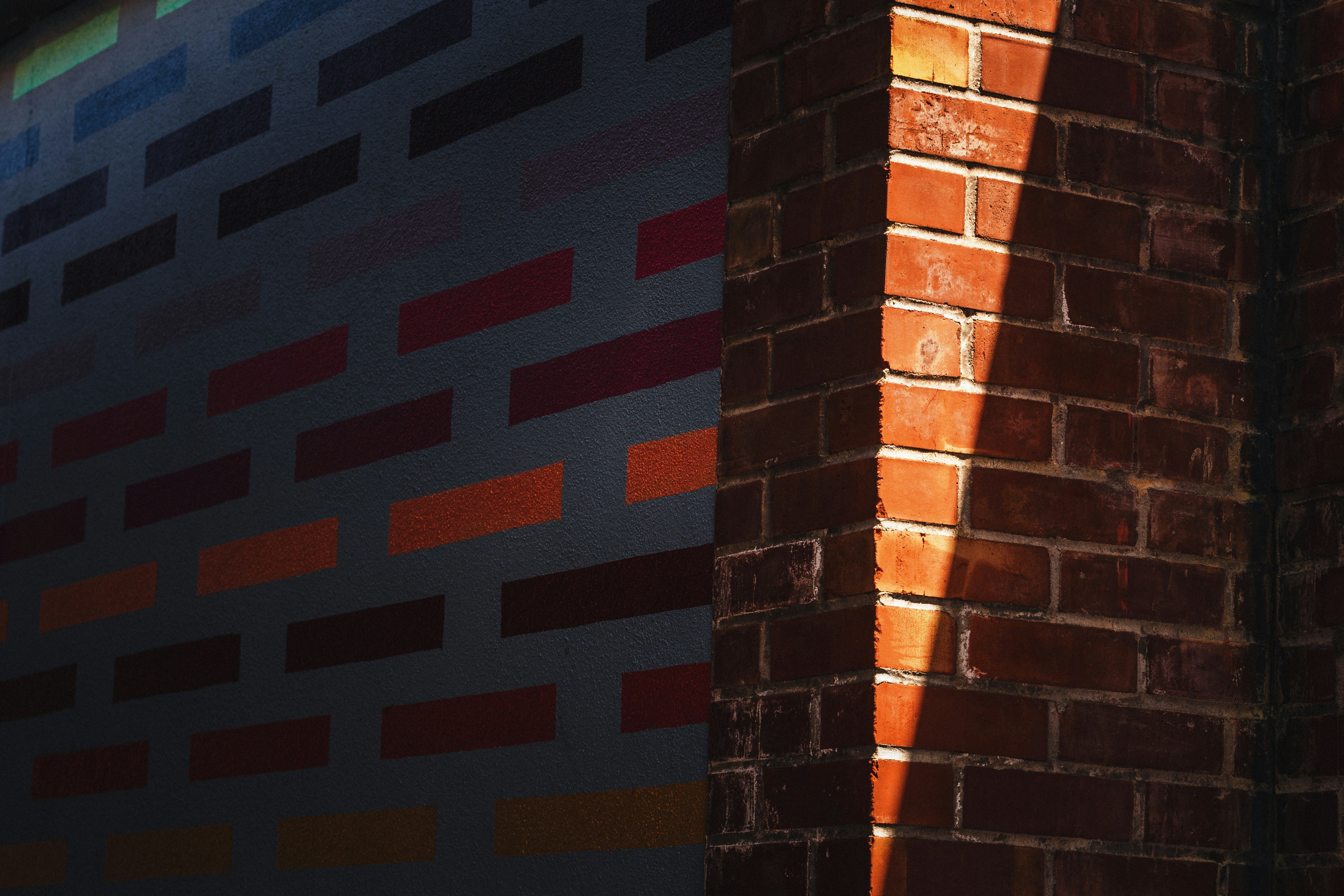 a brick wall with a light shining on it