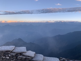 A panoramic view of the Himalayan salt mines with sunrise casting a warm glow over the landscape