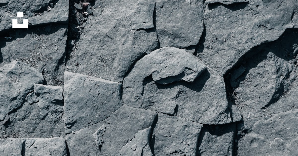 A close up of a rock wall made of rocks photo – Free Wallpaper Image on ...