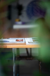 a blurry photo of a table with a magazine on it