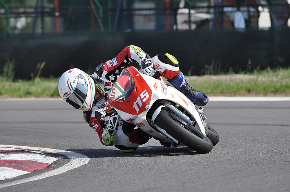 a person riding a motorcycle on a race track