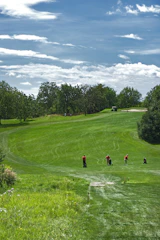 Golfers enjoying a friendly tournament on a sunny day at Pavenham Park Golf Club.