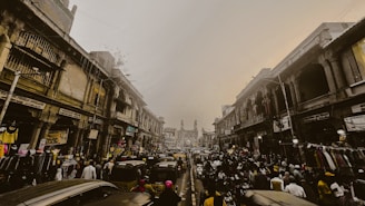 A busy street scene in India with various small shops and vehicles, representing everyday financial needs.