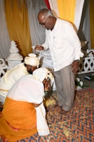 A young couple receiving a blessing and support for their new home.