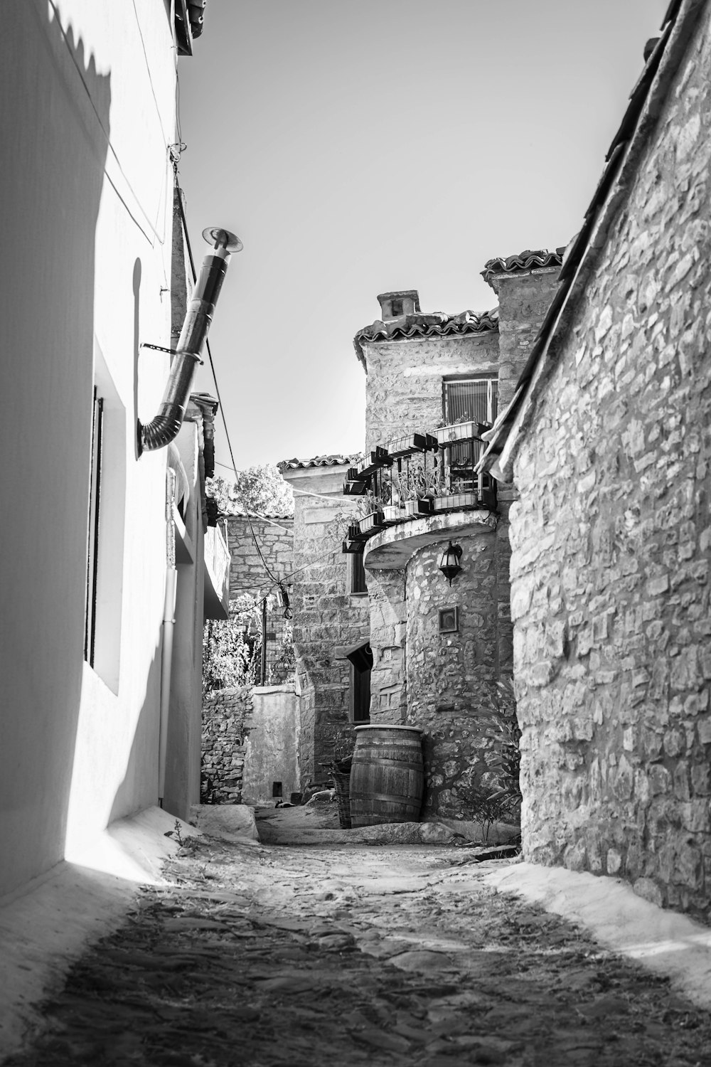 black and white photograph of a narrow alleyway