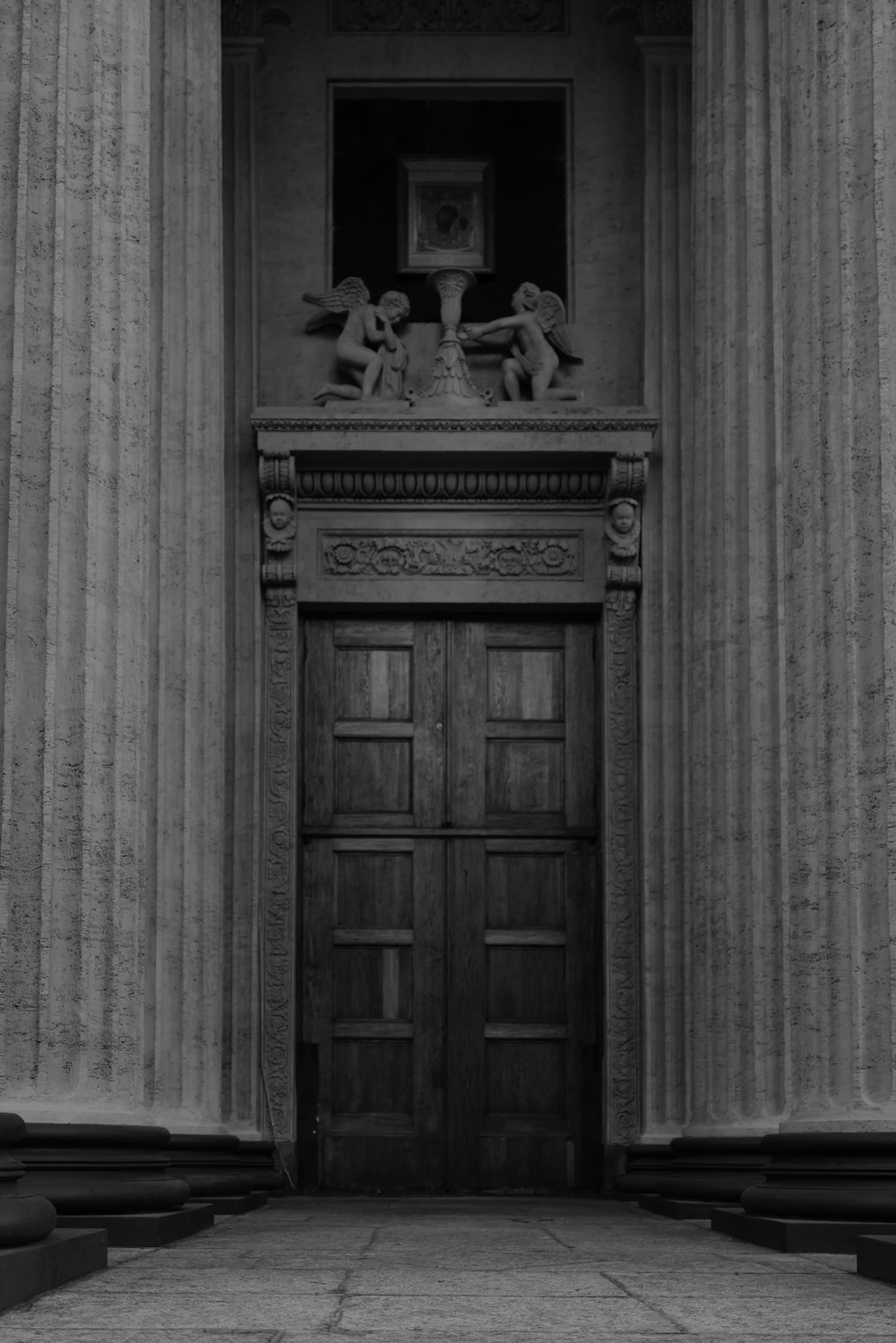 a black and white photo of an entrance to a building