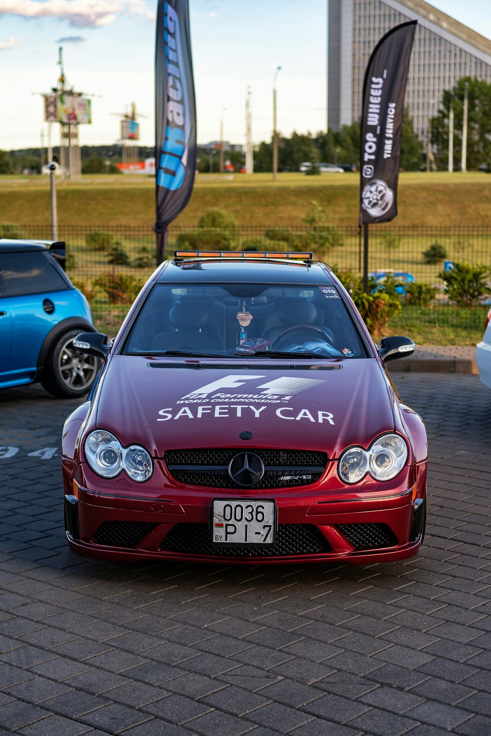 a red car with a safety car sticker on it