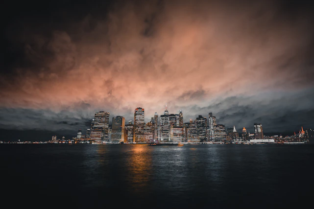 A sleek, dark city skyline at dusk, symbolizing power and ambition.