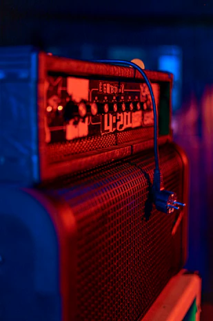 a red and blue radio sitting on top of a table
