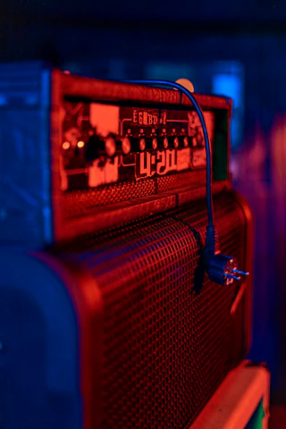 a red and blue radio sitting on top of a table