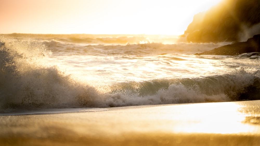 a person riding a surfboard on top of a wave