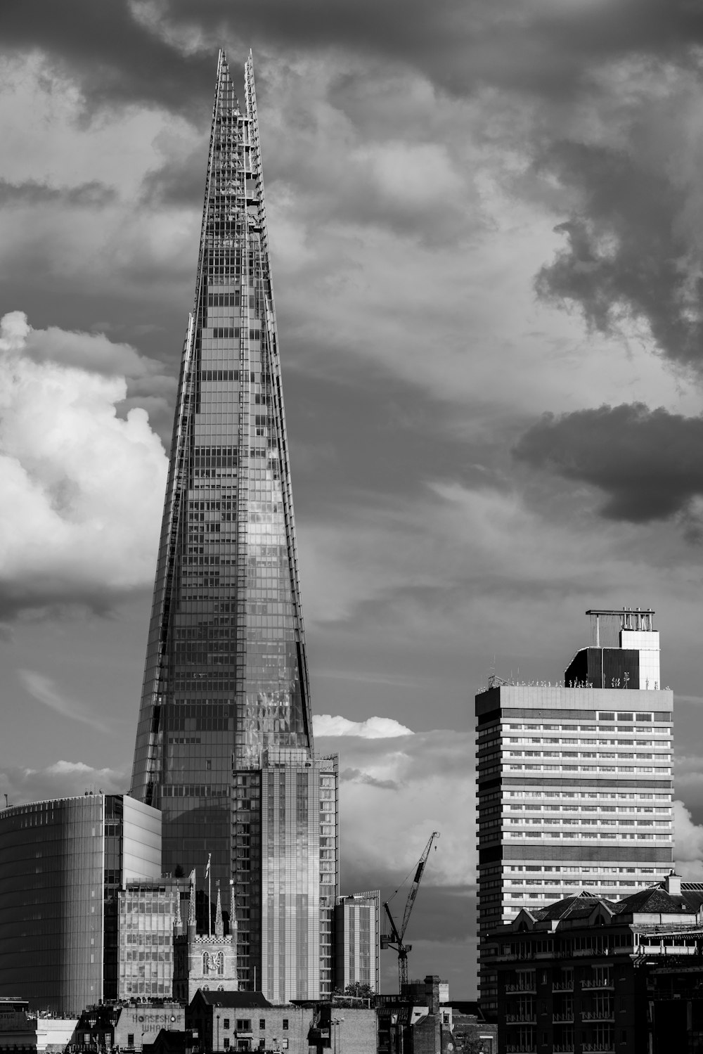 a black and white photo of a very tall building