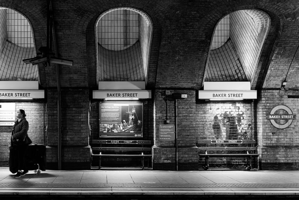 a black and white photo of a train station