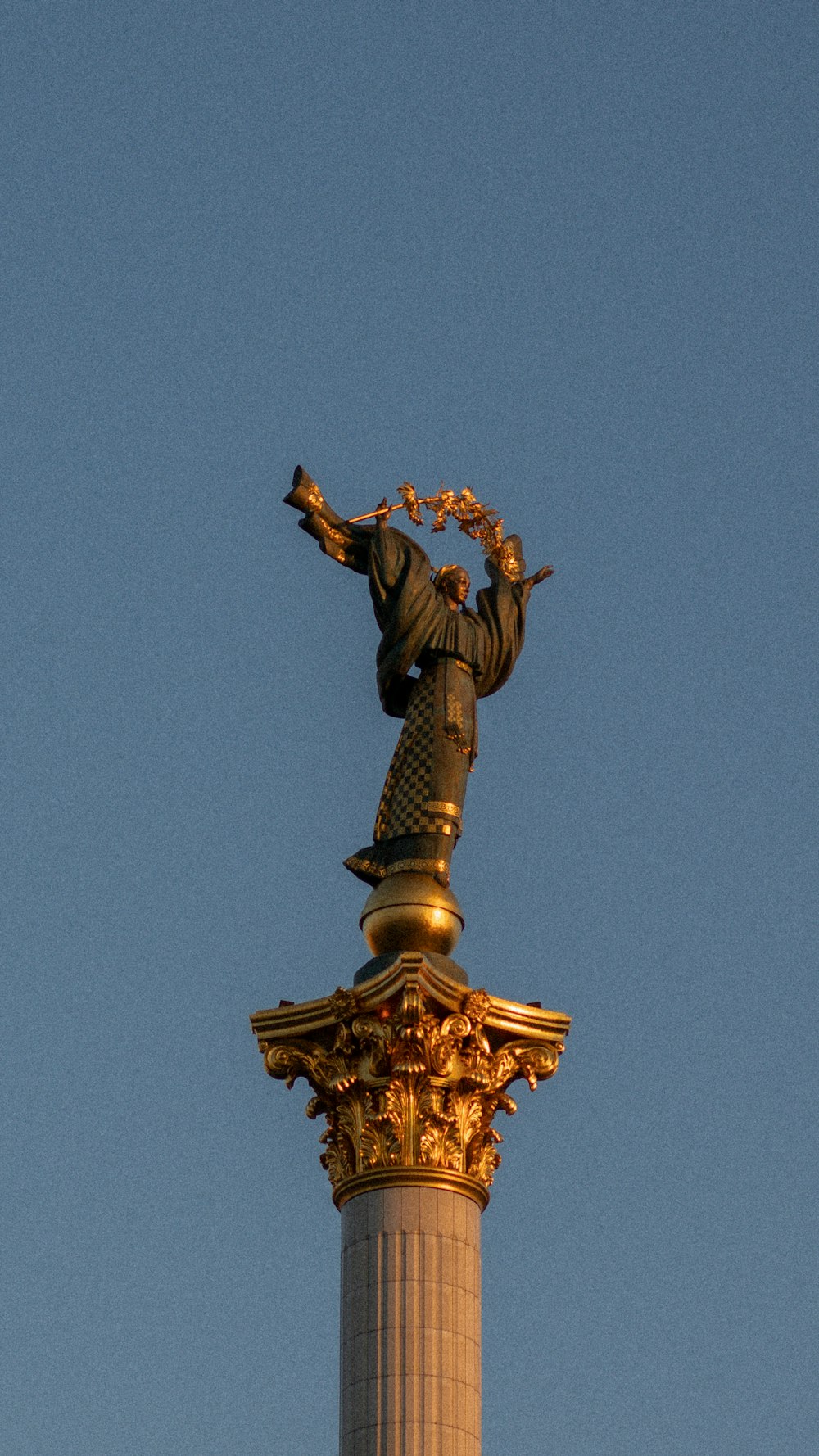 a statue on top of a tall building