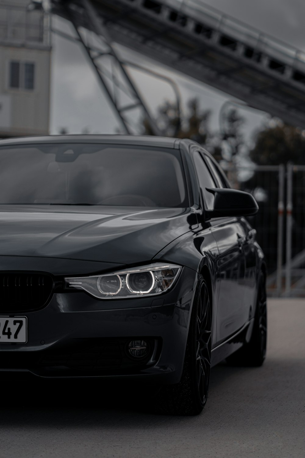 a black car parked in front of a building