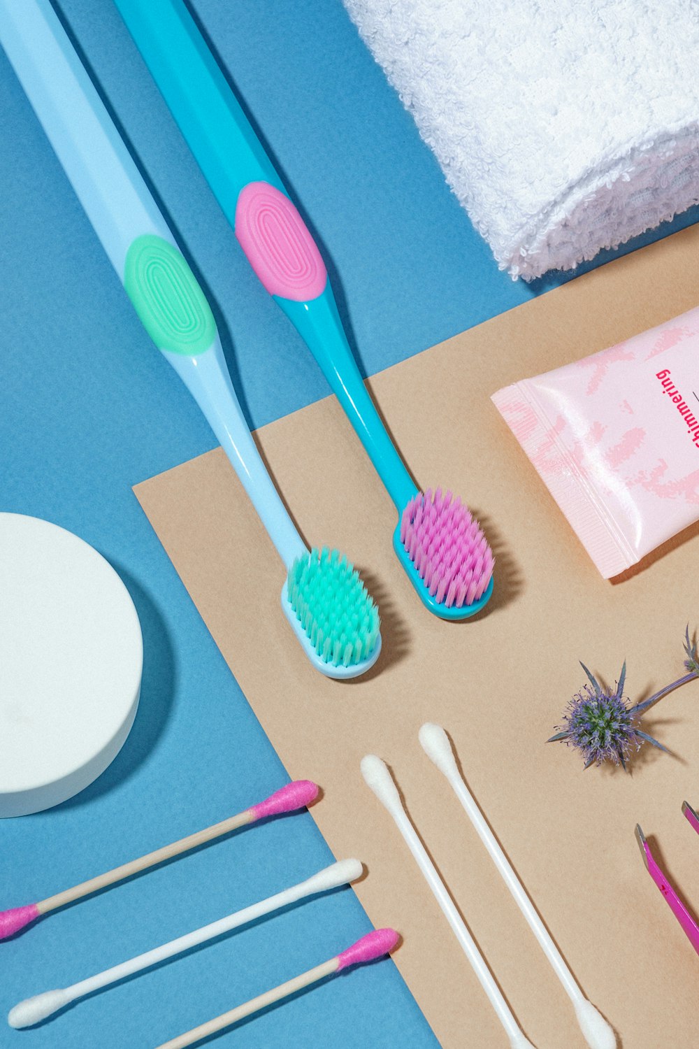 toothbrushes, toothpaste, soap, and other items laid out on