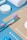 Various toiletries are arranged neatly on a blue and beige background, including a colorful toothbrush, cotton swabs, a white rolled towel, and a round container.
