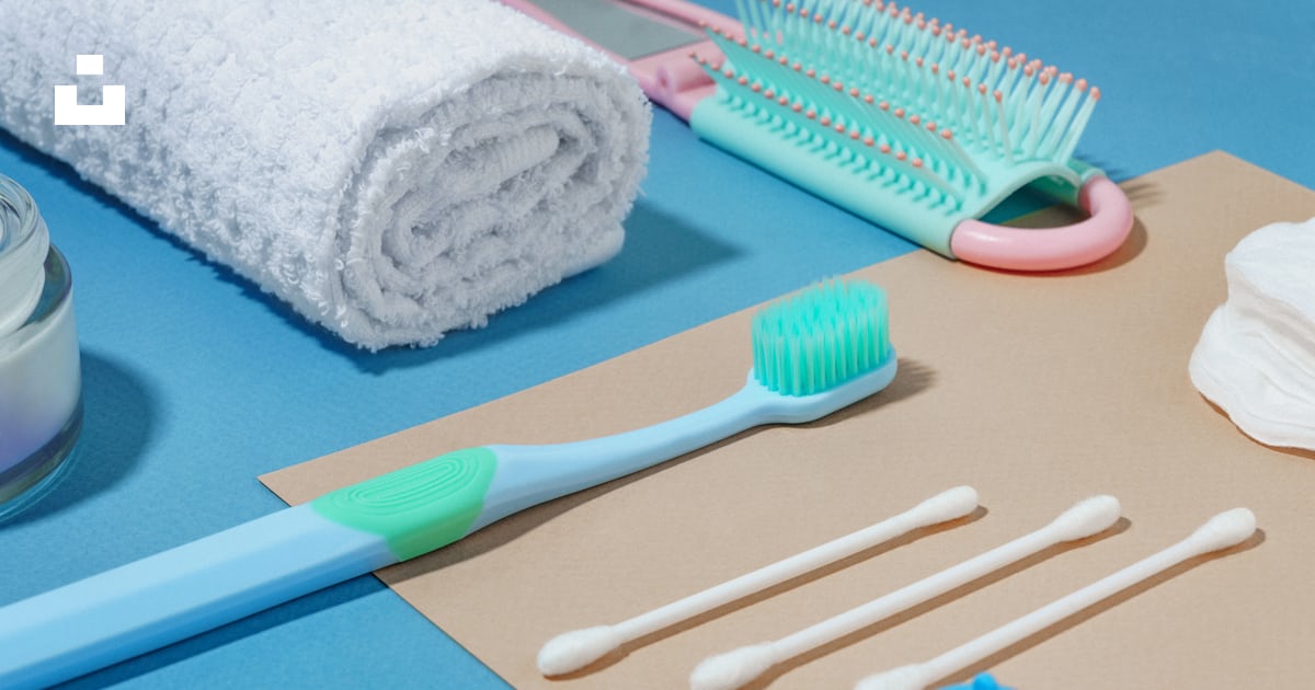 A blue toothbrush, toothpaste, toothpaste, and other items photo – Free ...