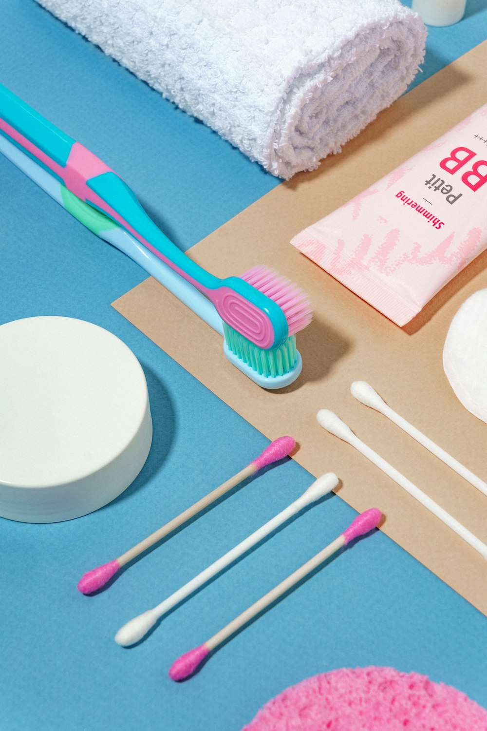 a blue table topped with toothbrushes and other items