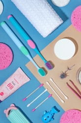 a table topped with lots of different types of toothbrushes