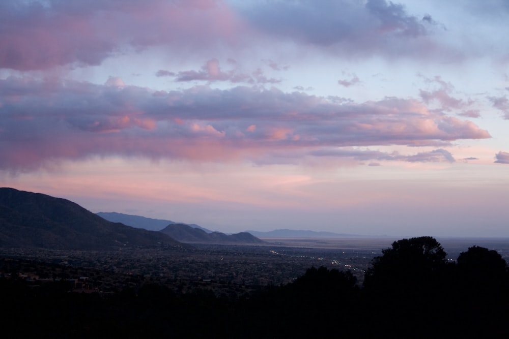 a view of a mountain range at sunset