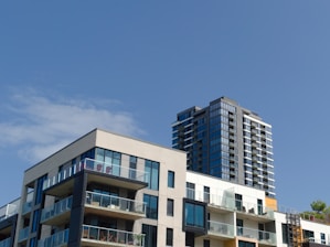 a couple of tall buildings sitting next to each other