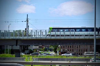 A modern train crossing a bridge symbolizing Franco-Moroccan railway connection.
