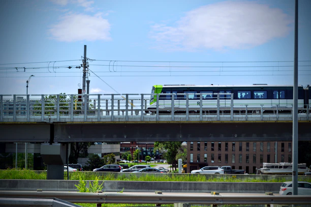 A modern train crossing a bridge symbolizing Franco-Moroccan railway connection.