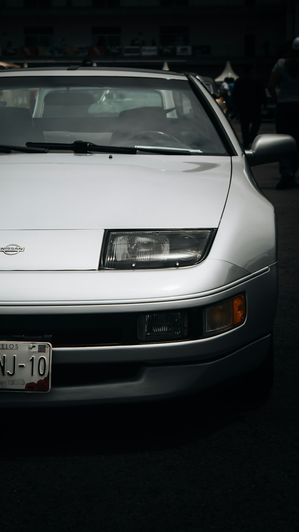 a white car parked in a parking lot