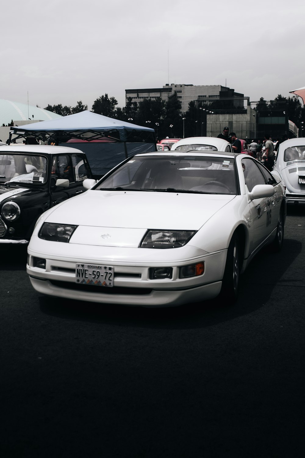 a group of cars parked next to each other in a parking lot