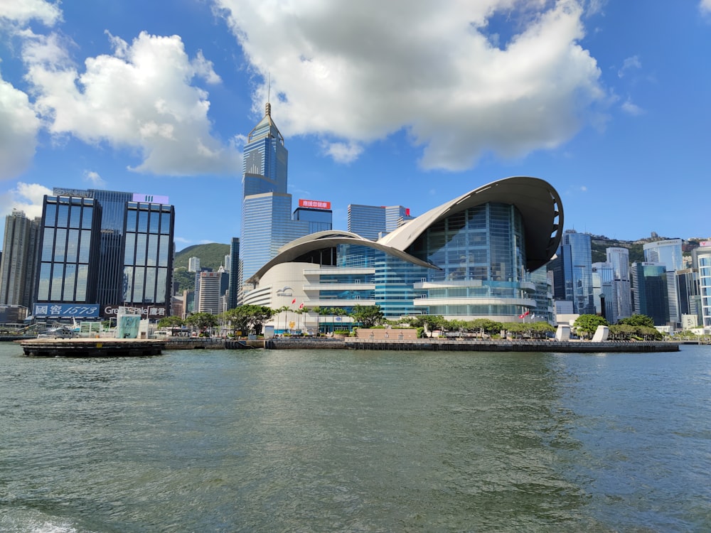 a large body of water with a city in the background