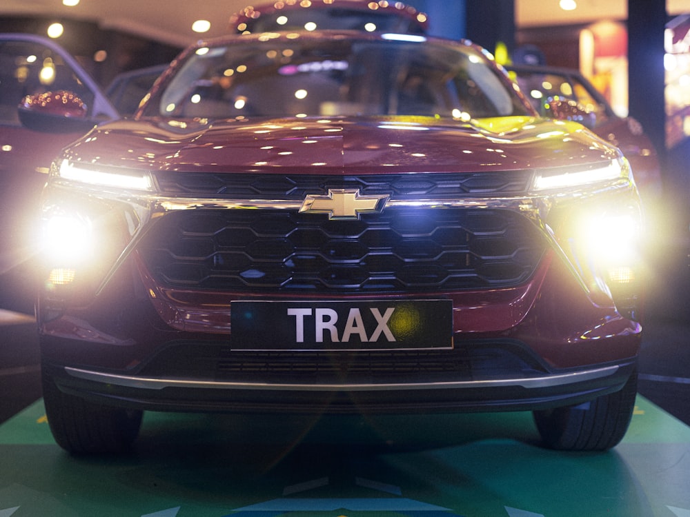 a close up of a car on display at a car show