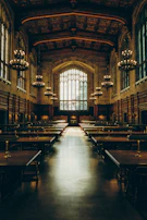 The main hall glowing warmly with candlelight and rich dark wood details.