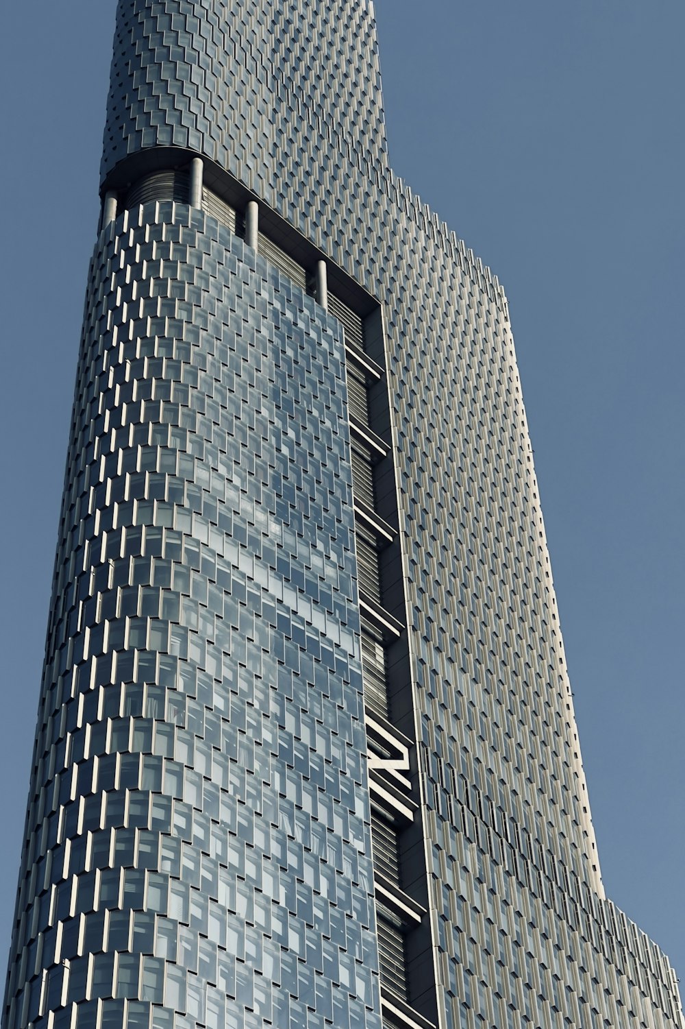 a very tall building with a very tall clock on it's side