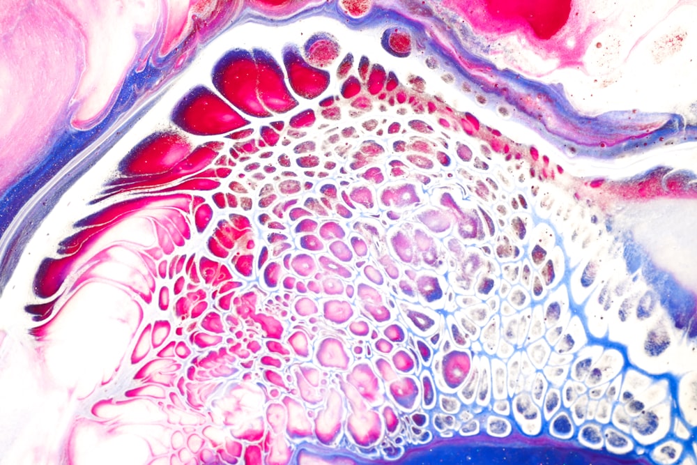 a close up view of a pink and blue substance