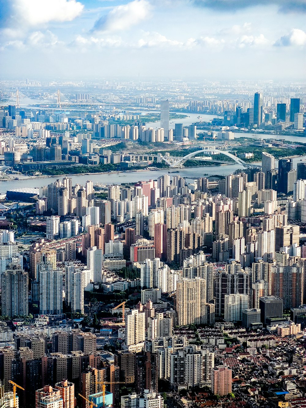 an aerial view of a city with tall buildings