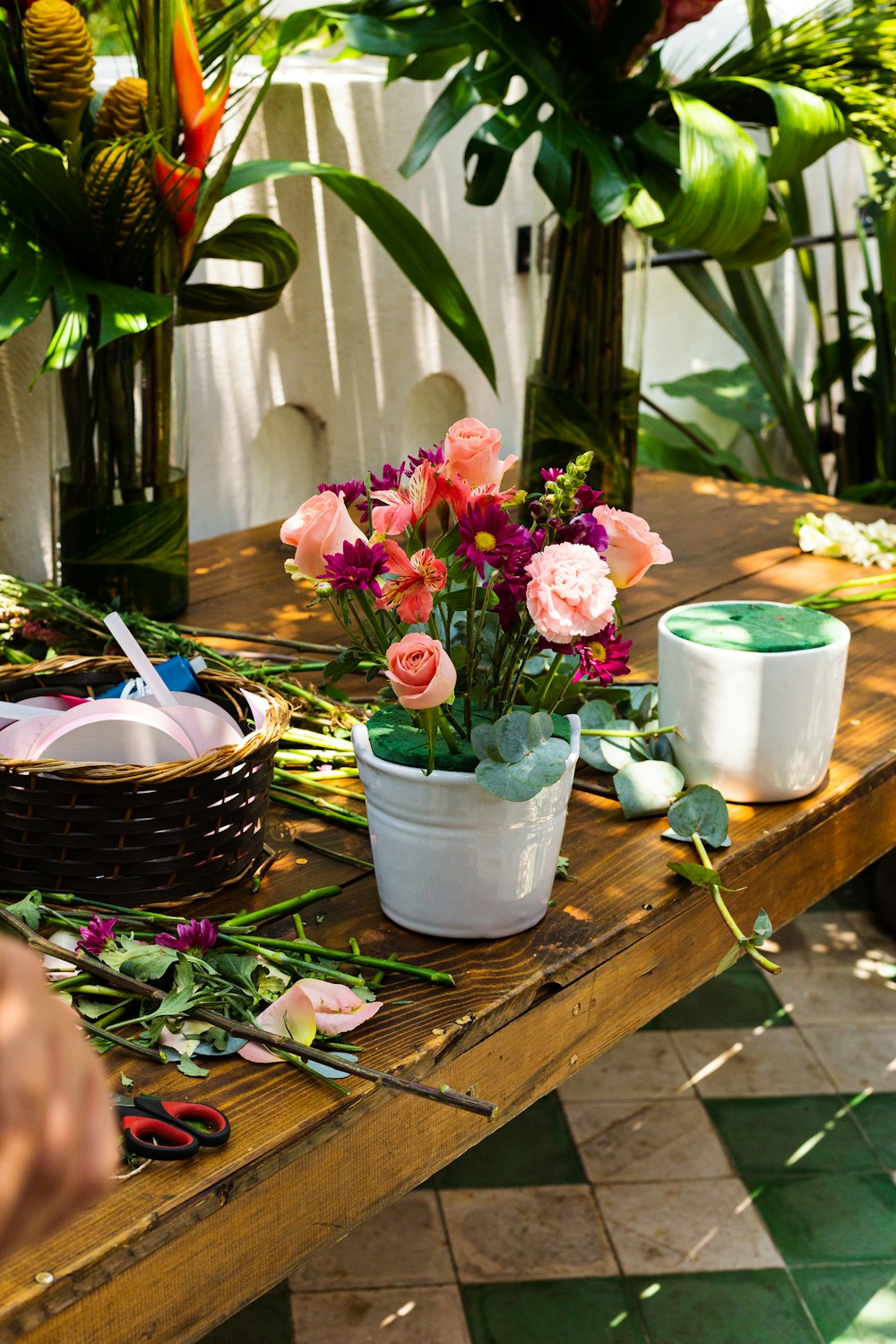 a wooden table topped with lots of flowers