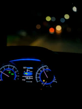 Close-up of a car dashboard showing improved fuel efficiency metrics.