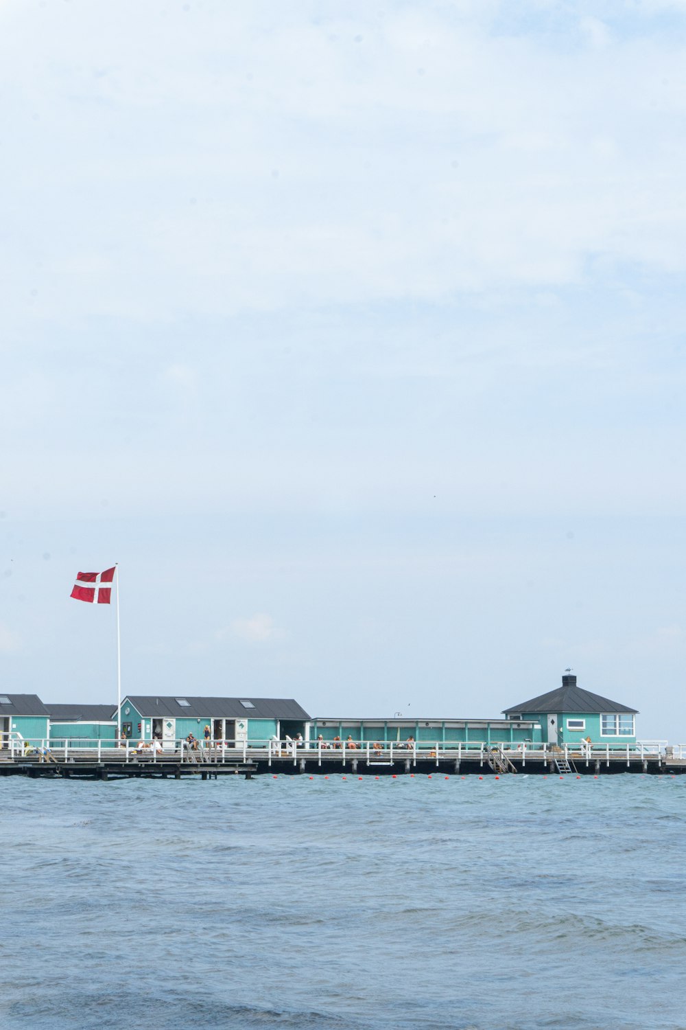 a large body of water with a flag on top of it