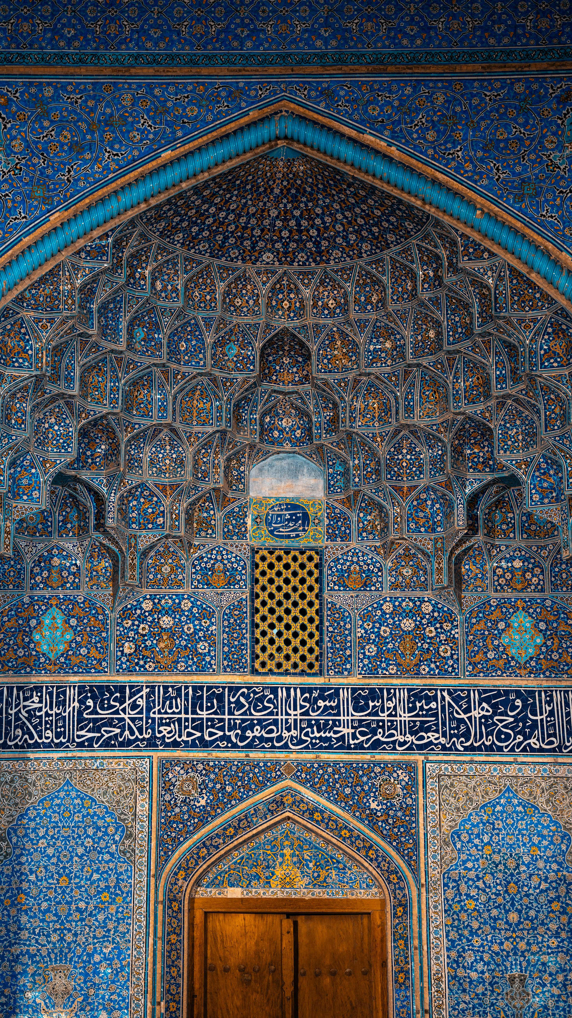 a doorway with a wooden door in a building