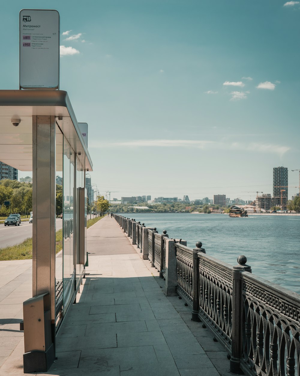 a walkway next to a body of water