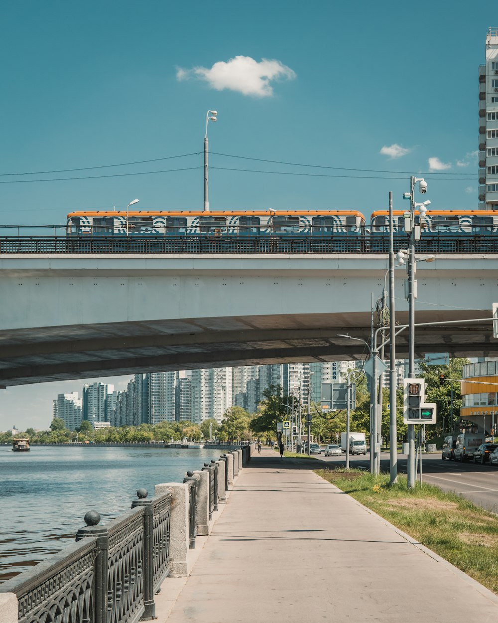 a train traveling over a bridge over a river