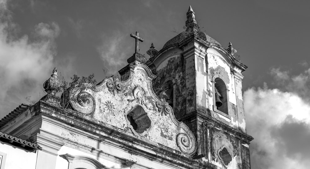 a black and white photo of a church steeple