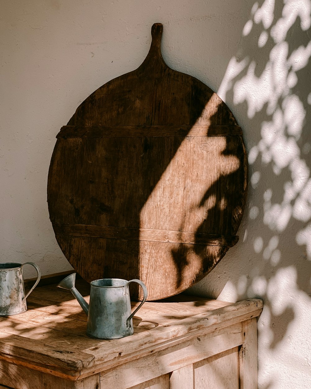 a wooden cutting board sitting on top of a wooden table